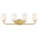 Savoy House - Capra, Warm Brass, 4-Light Bath - Add chic style to any bathroom with the Savoy House Capra 4-light bath bar. Its substantial structure features classic details along with white opal glassshades that are tapered like lamp shades and open at the top to give off a flattering glow. The large oval-shaped backplate helps to cover up any holes left behind from replacing old bath bars, too. Plus, the hardware for this fixture has been thoughtfully moved to the side of the backplate, allowing for a crisp and clean look. Finished in warm brass. This fixture is 31" wide and 9" tall. It extends 6.5" from the wall.