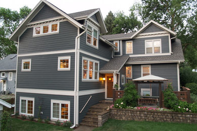 Photo of a mid-sized traditional two-storey exterior in Chicago with concrete fiberboard siding.