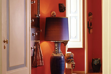 Photo of a large traditional foyer in Naples with multi-coloured walls, light hardwood flooring, a double front door, a light wood front door, white floors, a coffered ceiling and a feature wall.