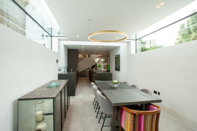 Modern dining room in London with feature lighting.