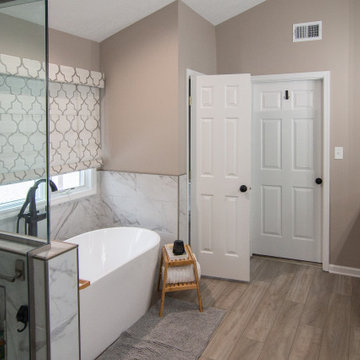 Traditional Master Bathroom With Warm Tones, Stand Alone Tub & Walk In Shower