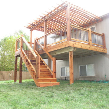 "Arch knotty" cedar deck with pergola