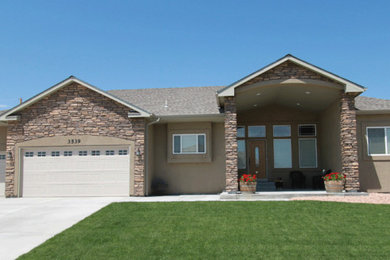 Example of a mid-sized classic brown one-story exterior home design in Denver with a shingle roof and a gray roof