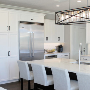 White Cabinet Kitchen With Black Accents and Viking Appliances