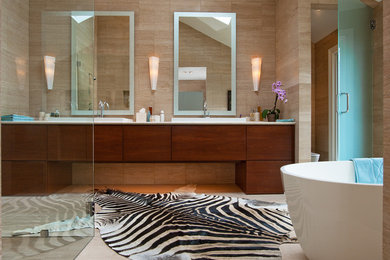 Example of a large minimalist master beige tile and porcelain tile porcelain tile bathroom design in Atlanta with flat-panel cabinets, dark wood cabinets, beige walls and a drop-in sink
