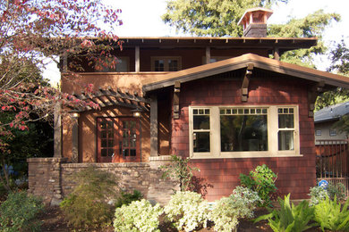 This is an example of an arts and crafts two-storey exterior in Sacramento with mixed siding.