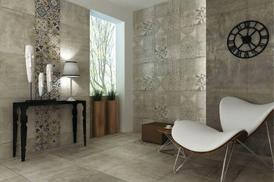 Example of a mid-sized trendy porcelain tile and gray floor hallway design with gray walls