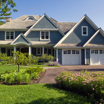 Stone and Cedar Shingle Lakefront Retreat with Wrap Around Covered Porch