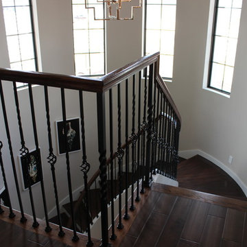 Curved Red Oak Stair with Single Basket & Twist Iron Balusters