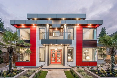 Large minimalist two-story metal house exterior photo in Vancouver
