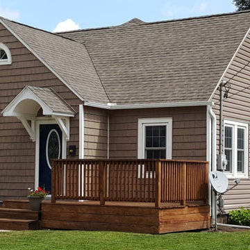 Homeowners install vinyl windows & vinyl siding