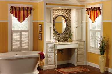 Example of a mid-sized transitional master mosaic tile dark wood floor and brown floor freestanding bathtub design in Other with flat-panel cabinets, white cabinets, yellow walls, an undermount sink and granite countertops