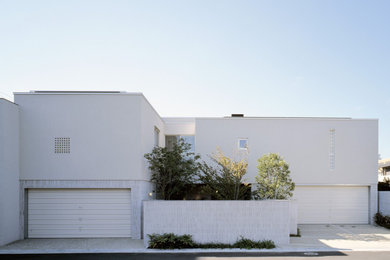 Ejemplo de fachada de casa blanca y gris moderna extra grande de dos plantas con revestimiento de hormigón y tejado plano