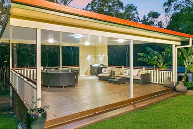 Inspiration for a backyard patio in Gold Coast - Tweed with decking and a gazebo/cabana.