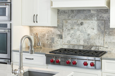 Kitchen pantry - large transitional l-shaped porcelain tile and gray floor kitchen pantry idea in Kansas City with a single-bowl sink, shaker cabinets, white cabinets, quartz countertops, gray backsplash, stone tile backsplash, stainless steel appliances, an island and white countertops