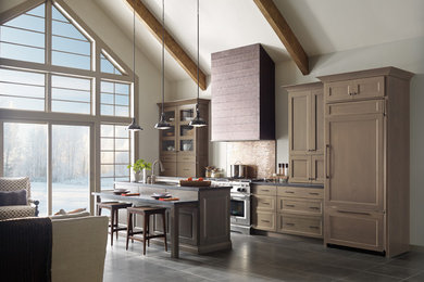 Single-wall ceramic tile eat-in kitchen photo in Grand Rapids with an undermount sink, recessed-panel cabinets, beige cabinets, concrete countertops, metallic backsplash, ceramic backsplash, stainless steel appliances and an island