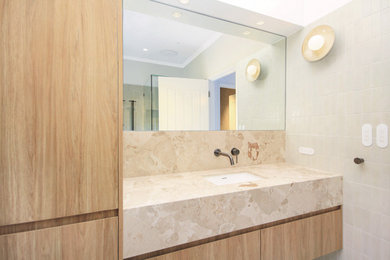 This is an example of a mid-sized asian bathroom in Gold Coast - Tweed with a drop-in tub, a corner shower, subway tile and a floating vanity.