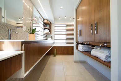Inspiration for a large modern master white tile and porcelain tile porcelain tile, beige floor, double-sink and wood wall bathroom remodel in New York with flat-panel cabinets, dark wood cabinets, a bidet, white walls, an integrated sink, solid surface countertops, white countertops and a built-in vanity