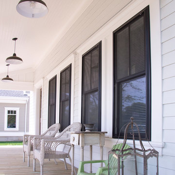 Black windows provide contrast with white siding