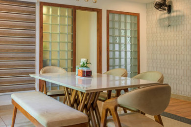 Kitchen/dining room combo - mid-sized tropical porcelain tile, beige floor and wallpaper kitchen/dining room combo idea in Other with beige walls and no fireplace