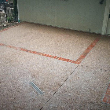 Exposed Aggregate patio with brick border.
