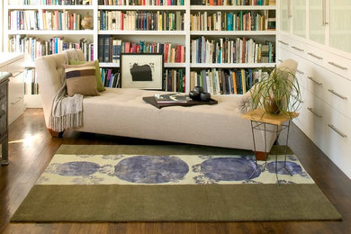 Family room - mid-sized contemporary carpeted family room idea in Toronto with beige walls and no fireplace