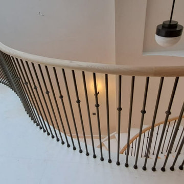 Oak handrail on a stone staircase