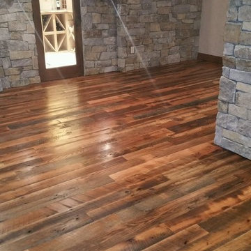 Antique Skip Oak Flooring in a Stone Walled Lower Level