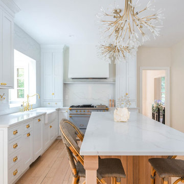 Château Charm: French-Inspired Kitchen Renovation with Plaster Hood Blue Stove a