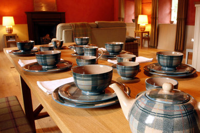 This is an example of a shabby-chic style dining room in Other.