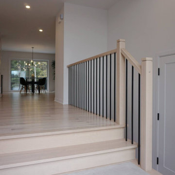 Modern Light Wood Staircase with Black Spindles