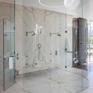 Serenity Indian Wells luxury desert home modern circular glass shower with marbl