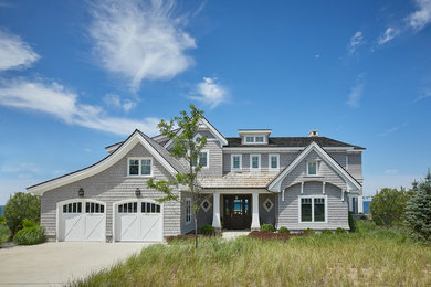 This is an example of a beach style home design in Grand Rapids.