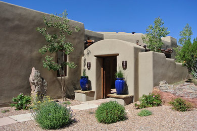 Large tuscan home design photo in Albuquerque