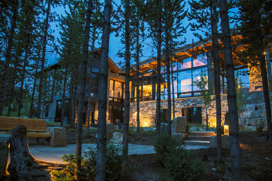Large rustic brown two-story mixed siding exterior home idea in Other