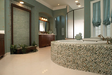 Inspiration for a large modern master ceramic tile and beige floor bathroom remodel in Austin with recessed-panel cabinets, brown cabinets, blue walls, a drop-in sink and quartz countertops