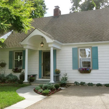 Colonial Style Front Portico with Columns and Blue Stone Sidewalk