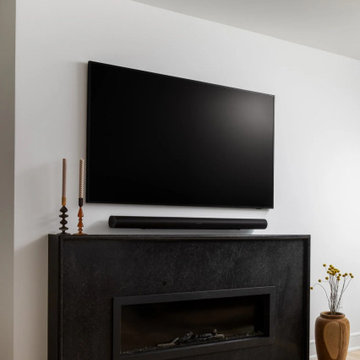 Dark Stone Fireplace Surround in Renovated Living Room