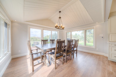 Example of an arts and crafts dining room design in Toronto