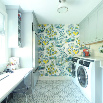 Floral wallpaper in Laundry Room with Blue Cabinets