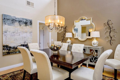 Transitional separate dining room in San Diego with beige walls, light hardwood floors and beige floor.