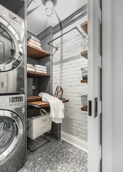 Industrial Laundry Room by Designstorms LLC