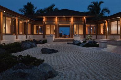 Example of a huge zen brown one-story wood exterior home design in San Francisco with a hip roof