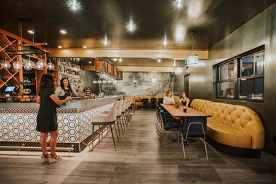 Inspiration for an eclectic home bar remodel in Other