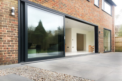 Example of a minimalist home design design in Hertfordshire