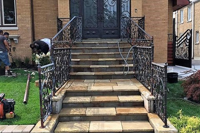 Design ideas for a medium sized classic metal railing staircase in Chicago.