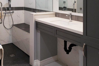 Minimalist white tile and porcelain tile porcelain tile, white floor and single-sink bathroom photo with shaker cabinets, gray cabinets, white walls, an undermount sink, quartzite countertops, white countertops and a floating vanity