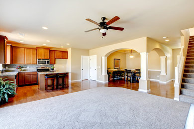 Large elegant open concept carpeted family room photo in Atlanta with yellow walls