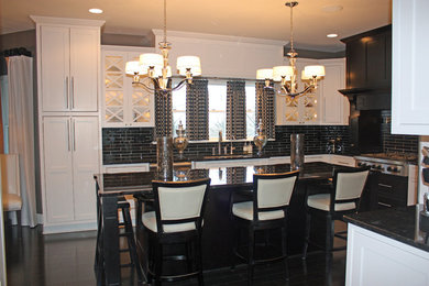 Inspiration for a mid-sized contemporary u-shaped dark wood floor eat-in kitchen remodel in Other with shaker cabinets, white cabinets, black backsplash, stainless steel appliances, an island, a double-bowl sink and subway tile backsplash