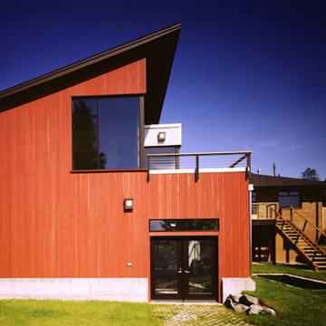 Addition in foreground, original house in background